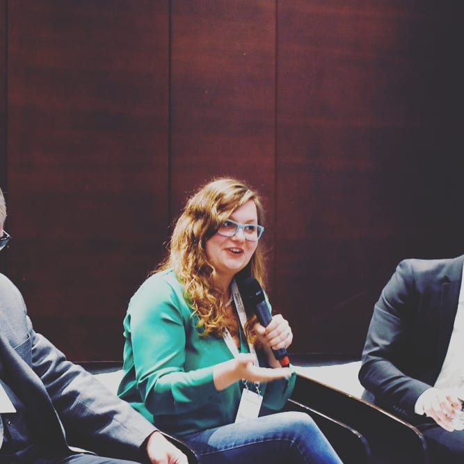 Hannah Bink speaking on a conference panel